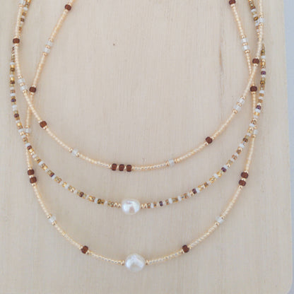 Set of 3 beaded necklaces in beige and red wine colours with gold accents