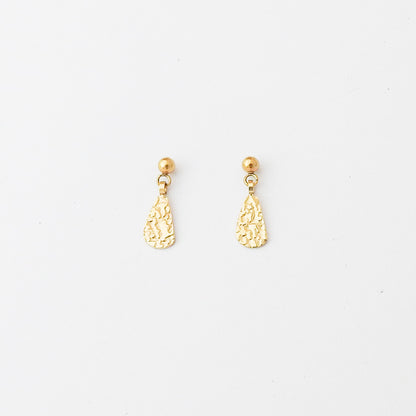 A pair of gold dangle earrings with textured teardrop-shaped charms and small round gold studs, displayed on a clean white background.