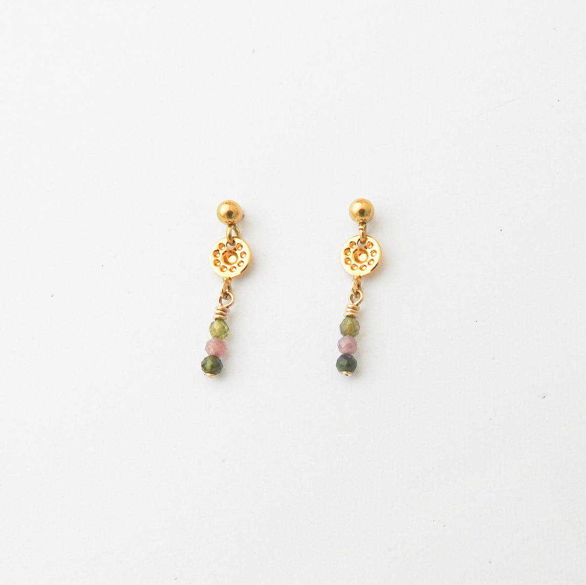 A pair of gold dangle earrings with small multicolored beads, displayed on a clean white background.