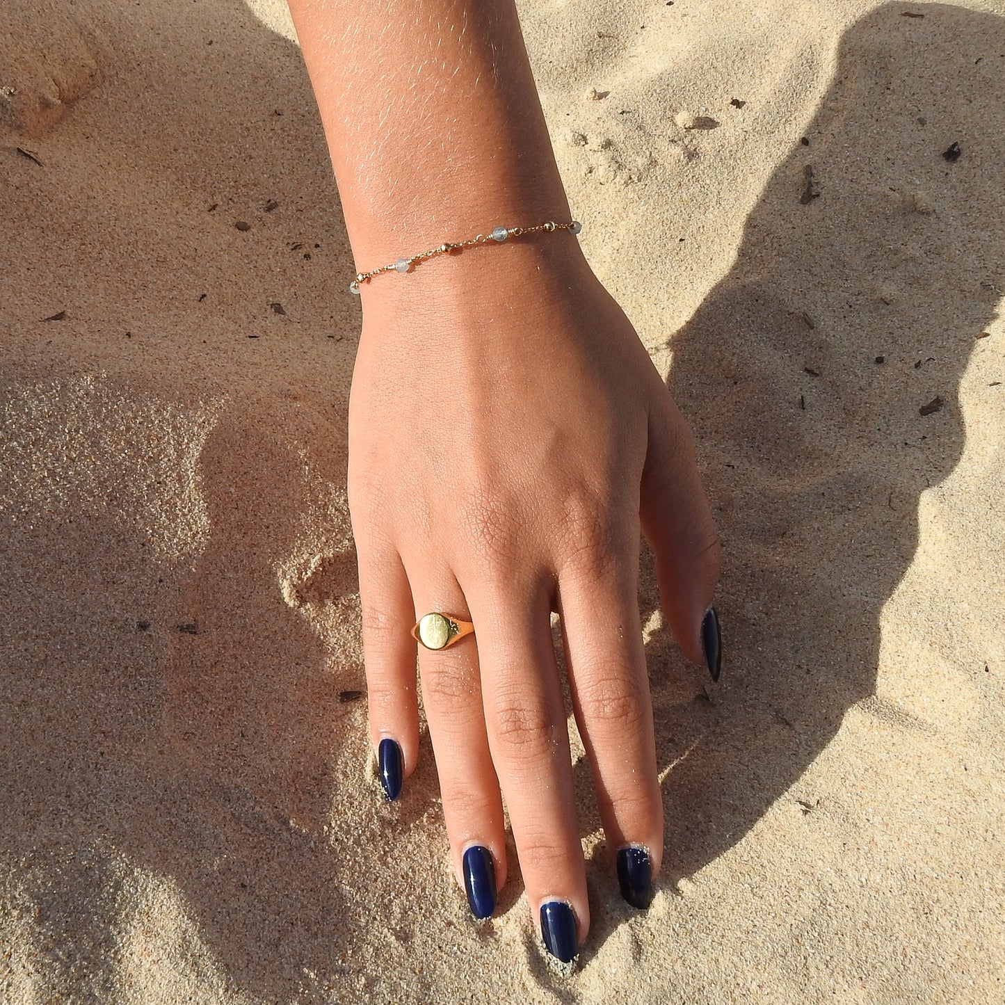 March birthstone bracelet with interchanging gold pebbles and gemstones