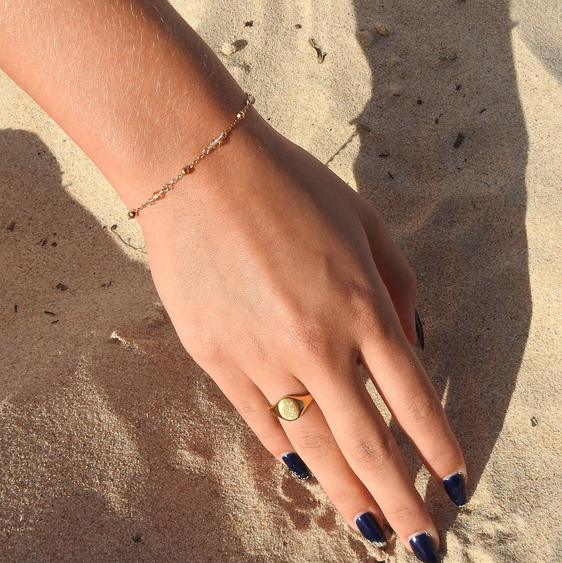 November birthstone bracelet with interchanging gold pebbles and gemstones
