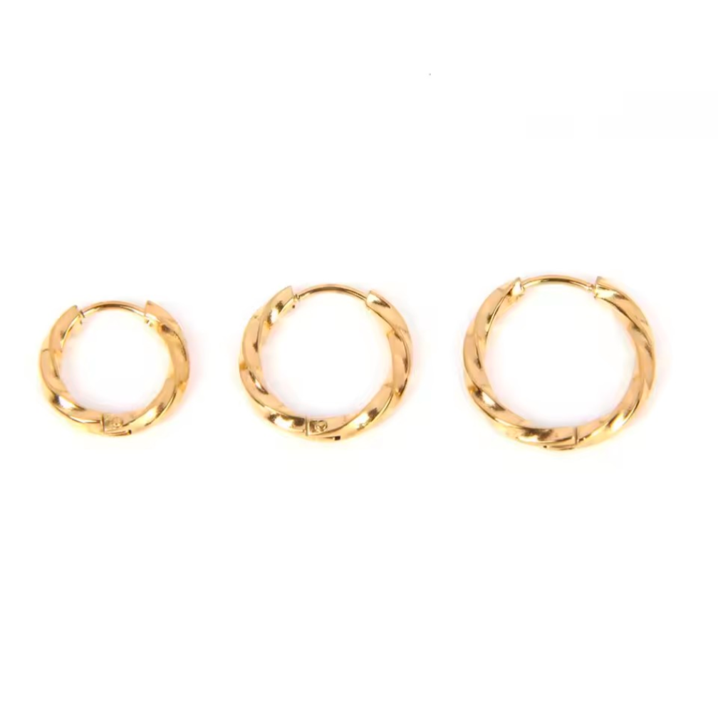 Three gold huggie hoop earrings of different sizes arranged horizontally on a plain white background.